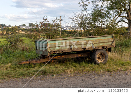 Old Rusting Farm Trailer Abandoned on a Farm Track Verge 130135453