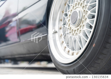 Close-Up of Custom Car Wheel and Tire Excellence.  130135634