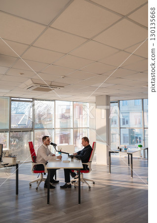 Two Caucasians Recording an Audio Podcast.  130135668