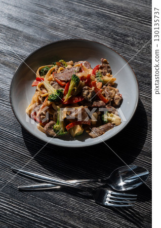 Pasta with beef, mushrooms and vegetables. Pasta with beef, mushrooms and vegetables. 130135737