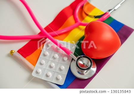 Rainbow flag, pills, heart and stethoscope. Rainbow flag, pills, heart and stethoscope. 130135843