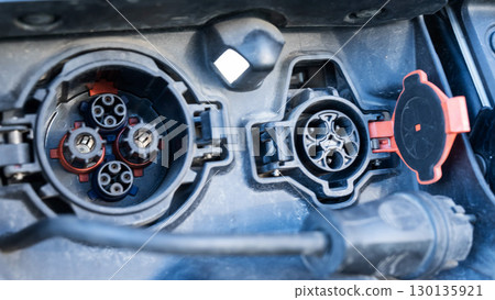 Close-up of an electric vehicle charging port.  130135921