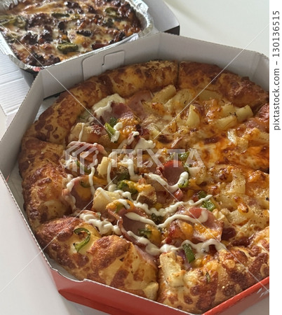 A delicious pizza with a golden crust, melted cheese, and savory toppings. Perfect for food-related designs, menus, or Italian-themed projects, capturing the essence of a classic comfort dish. A delicious pizza with a golden crust, melted cheese, and savory toppings. Perfect for food-related designs, menus, or Italian-themed projects, capturing the essence of a classic comfort dish. 130136515