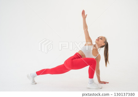 Caucasian woman doing sports exercises on white background. Caucasian woman doing sports exercises on white background. 130137380