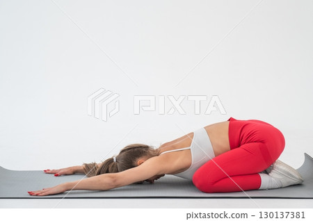 Caucasian woman doing sports exercises on white background. Caucasian woman doing sports exercises on white background. 130137381