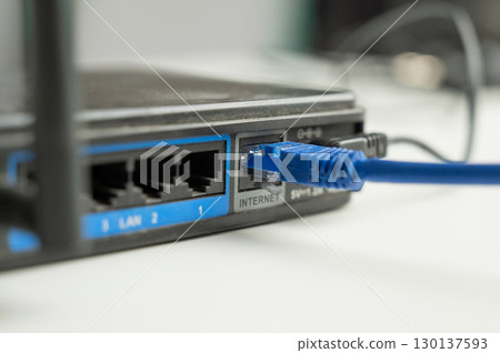 The internet cable is plugged into the router.  130137593