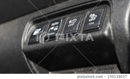 Buttons on the dashboard of an electric vehicle. 130138037