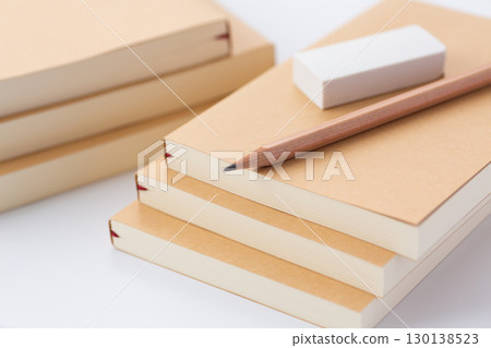 Paper book (paperback), pencil and eraser 130138523