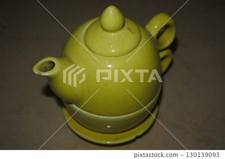 ceramic teapot with yellow teapot and cup ceramic teapot with yellow teapot and cup 130139093