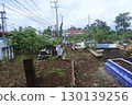 a wooden beehives with a metal bucket 130139256