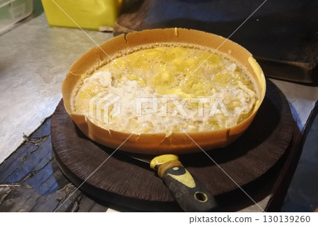 pie with cheese on the kitchen table pie with cheese on the kitchen table 130139260