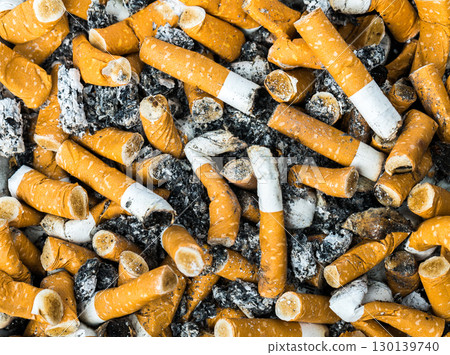 Discarded cigarette butts and ash create powerful anti-smoking awareness campaign visual Discarded cigarette butts and ash create powerful anti-smoking awareness campaign visual 130139740