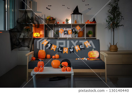 Halloween Decor. Cozy living room adorned with festive pumpkins and banners. Halloween Decor. Cozy living room adorned with festive pumpkins and banners. 130140440
