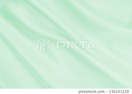 Smooth elegant green silk or satin luxury cloth texture as abstract background. Luxurious background design Smooth elegant green silk or satin luxury cloth texture as abstract background. Luxurious background design 130141220