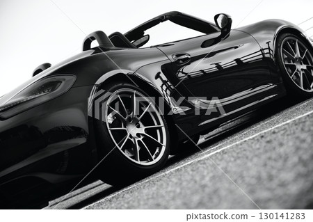 A shiny black convertible 130141283