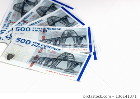 White background with Danish kroner banknotes heap White background with Danish kroner banknotes heap 130141371
