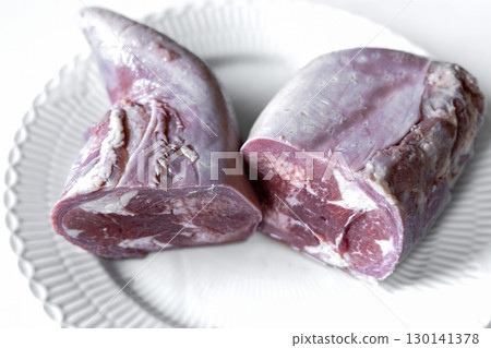 Sliced beef tongue neatly arranged on plate 130141378