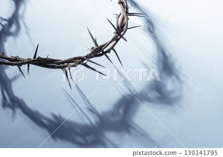 Jesus Crown of thorns shadow silhouette against textured gray surface, symbol spiritual pain and redemptive struggle Banner good friday background, Christian Easter for concept 130141795
