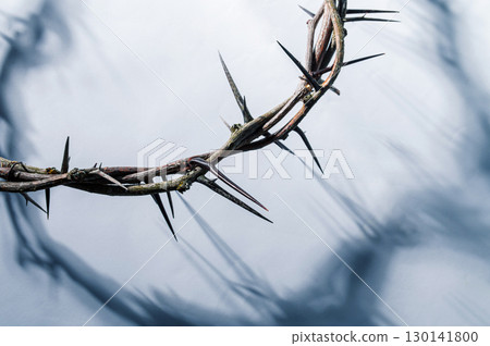 Jesus Crown of thorns shadow silhouette against textured gray surface, symbol spiritual pain and redemptive struggle Banner good friday for Christian Easter background, concept Jesus Crown of thorns shadow silhouette against textured gray surface, symbol spiritual pain and redemptive struggle Banner good friday for Christian Easter background, concept 130141800