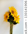 Three yellow sunflowers isolated on white background 130141906