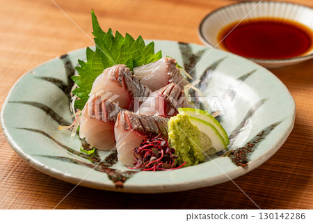sliced raw fish 130142286