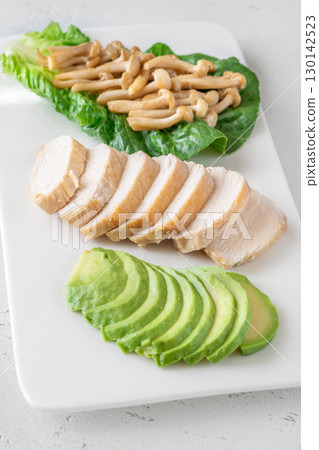 Avocado, mushrooms, and chicken presented as fresh minimalist healthy lifestyle plate Avocado, mushrooms, and chicken presented as fresh minimalist healthy lifestyle plate 130142523