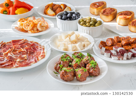 Spanish Tapas Spread with Jamon, Cheese, Shrimp, Olives 130142530