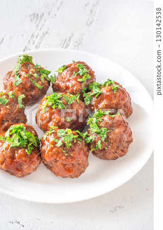 Juicy Spanish Albondigas Served in Tomato Sauce with Fresh Parsley on Top 130142538