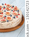 Whole cream cheese berry layer cake topped figs currant blueberries 130142723
