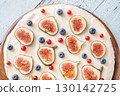 Whole cream cheese berry layer cake topped figs currant blueberries 130142725