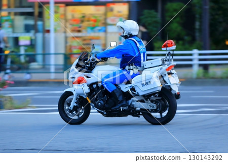 A police motorcycle on patrol A police motorcycle on patrol 130143292