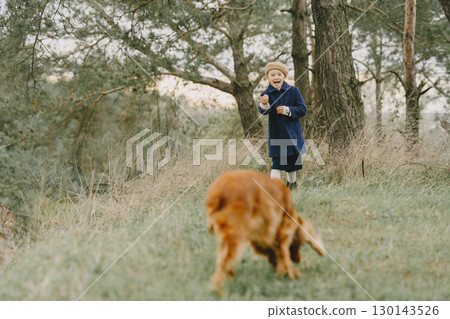 Friends are having fun in the fresh air. Child in a blue coat. Friends are having fun in the fresh air. Child in a blue coat. 130143526