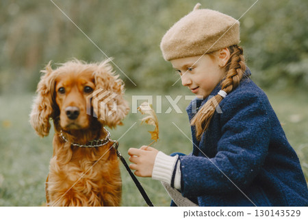 Friends are having fun in the fresh air. Child in a blue coat. 130143529