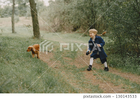 Friends are having fun in the fresh air. Child in a blue coat. Friends are having fun in the fresh air. Child in a blue coat. 130143533