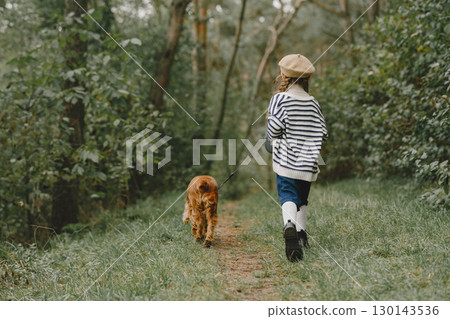 Friends are having fun in the fresh air. Child in a blue dress. Friends are having fun in the fresh air. Child in a blue dress. 130143536
