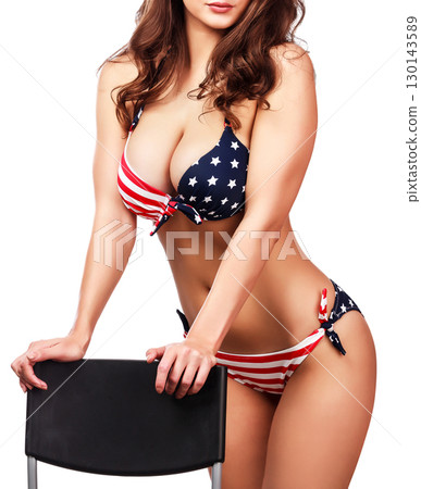 Woman in bikini with the USA flag print, isolated on white background 130143589