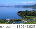 Omura Line train running along Omura Bay in summer 130143625