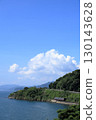 Omura Line train running along Omura Bay in summer 130143628