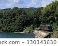 Omura Line train running along Omura Bay in summer 130143630
