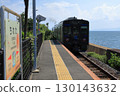 Omura Line train running along Omura Bay in summer 130143632