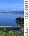 Omura Line train running along Omura Bay in summer 130143633