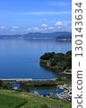 Omura Line train running along Omura Bay in summer 130143634