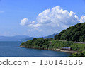 Omura Line train running along Omura Bay in summer 130143636