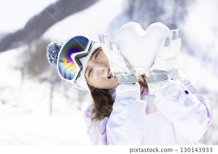Cute woman enjoying the snowy mountains Cute woman enjoying the snowy mountains 130143933