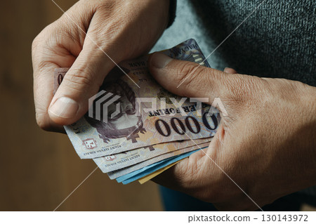 counting hungarian forint banknotes indoors 130143972