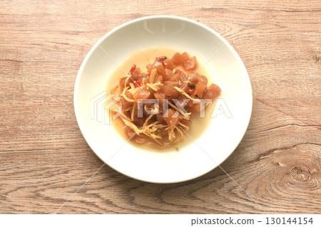 slick pickled rasidh with ginger and chili Chinese salad on plate 130144154