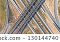 Drone shot aerial view of high angle view of intersection across the bridge against the countryside highway 130144740