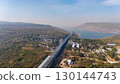 Drone shot aerial view landscape of the M6  motorway Expressway Nakhon Ratchasima Province - Bang Pa-in. Lam Ta Khong River and Mountain. Drone shot of scenic landscape rural place traffic. Nakhon 130144743