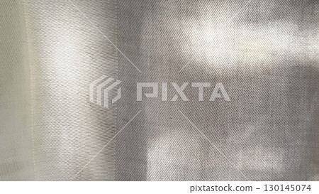 Shadows of white fabric, background of white fabric, background with light shining through 130145074