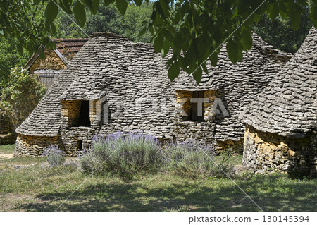 Historic dry stone agricultural buildings in Dordogne, France, showcasing traditional architecture 130145394